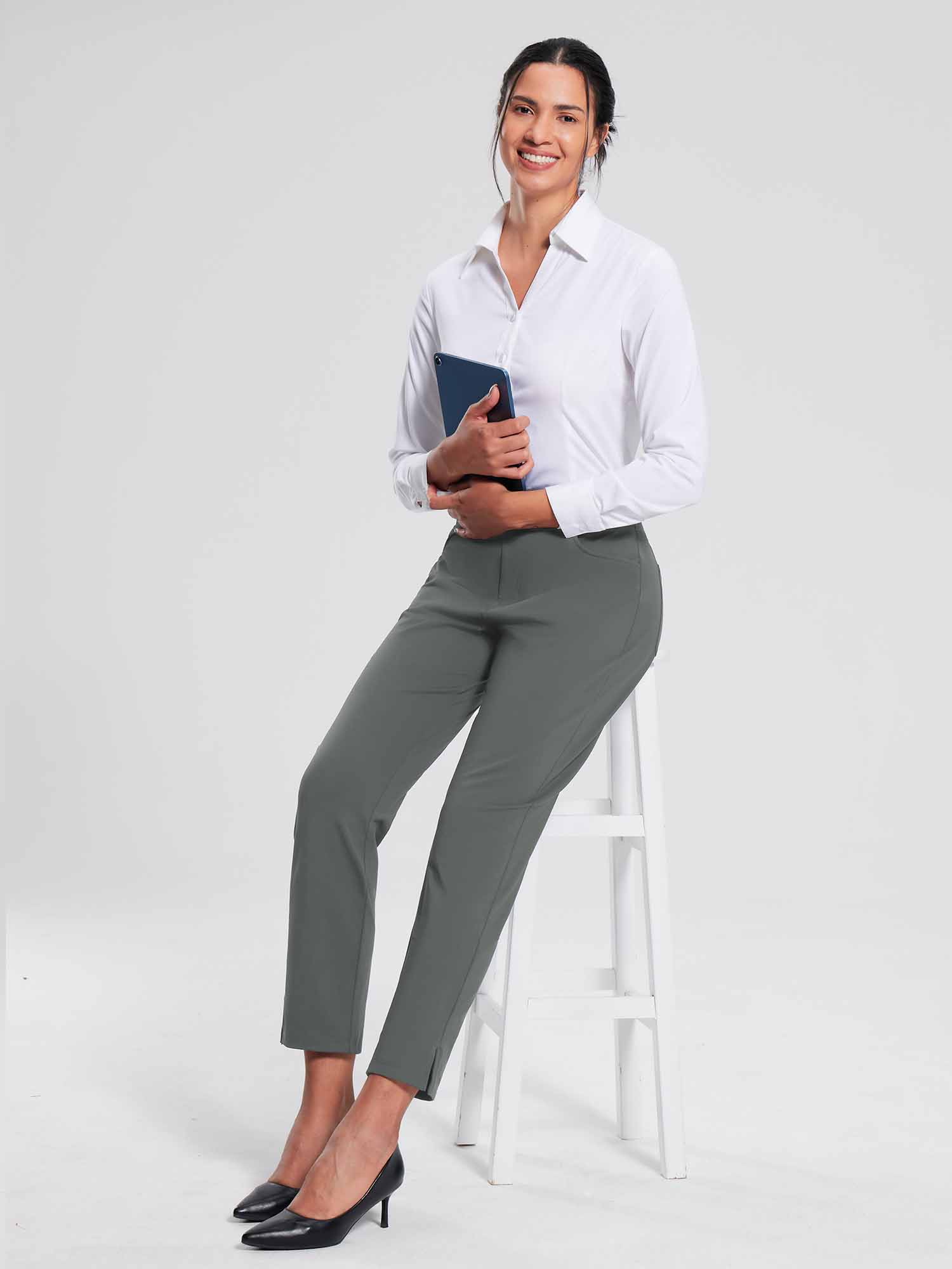 Woman in grey fleece-lined jogger pants and white button-down shirt holding a tablet. #color_Dark Gray