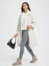 Grey thermal fleece high-waist yoga leggings worn with a winter coat and boots. #color_Dark Gray