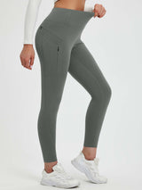 Grey 25" fleece-lined yoga leggings featuring a high waistband and secure zippered side pockets. #color_Dark Gray