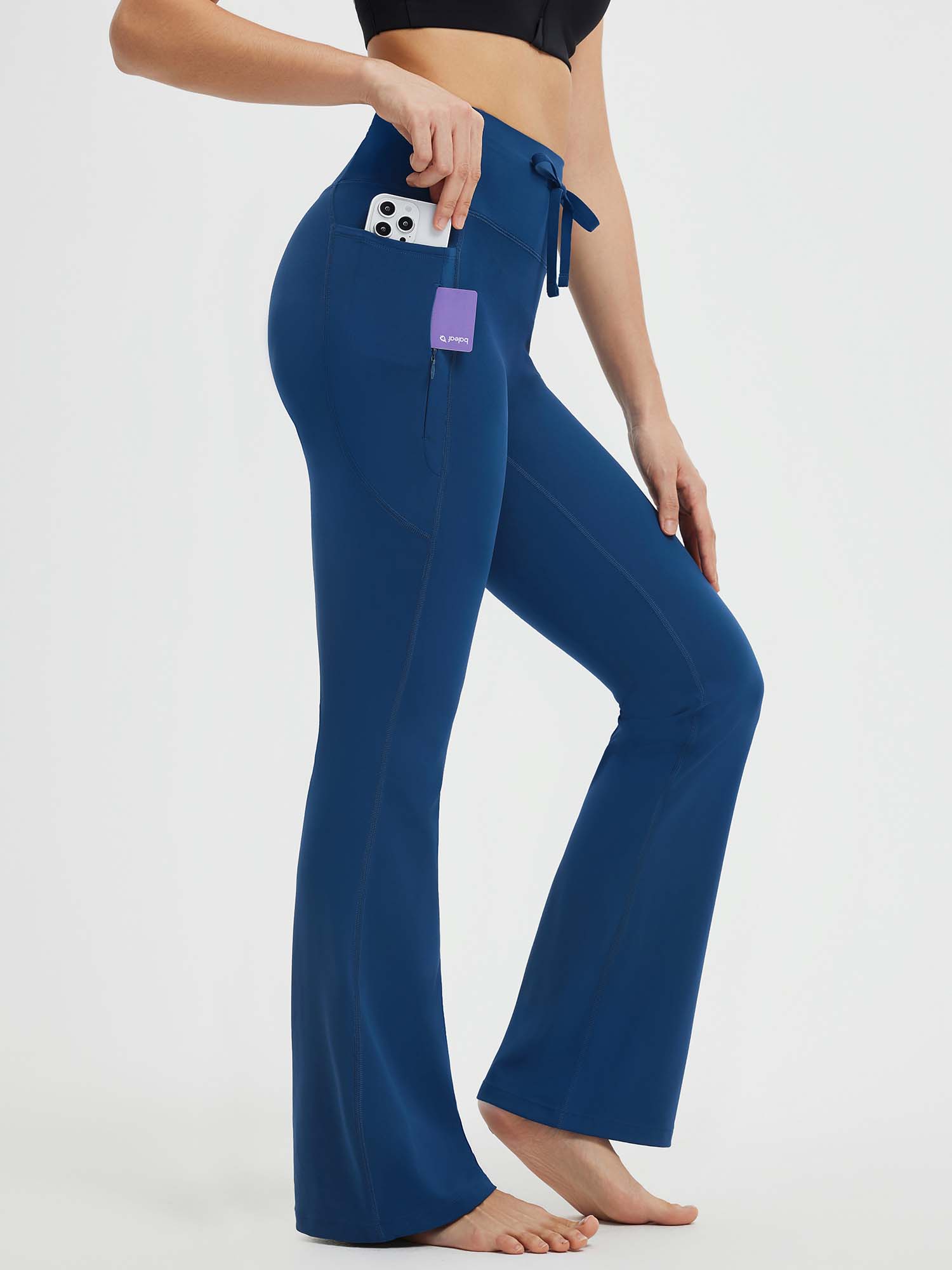 Deep blue high-waist flare yoga pants with drawstring and secure pockets for phone and keys. #Color_Navy Blue