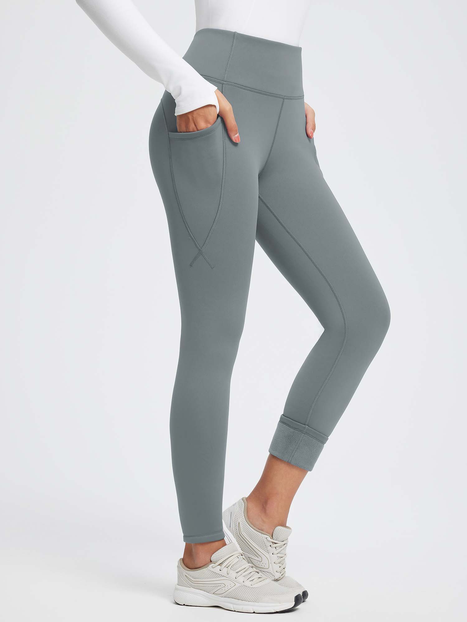 Grey thermal fleece-lined high-waist yoga leggings with deep side pockets. #color_Dark Gray