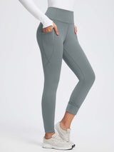 Grey thermal fleece-lined high-waist yoga leggings with deep side pockets. #color_Dark Gray