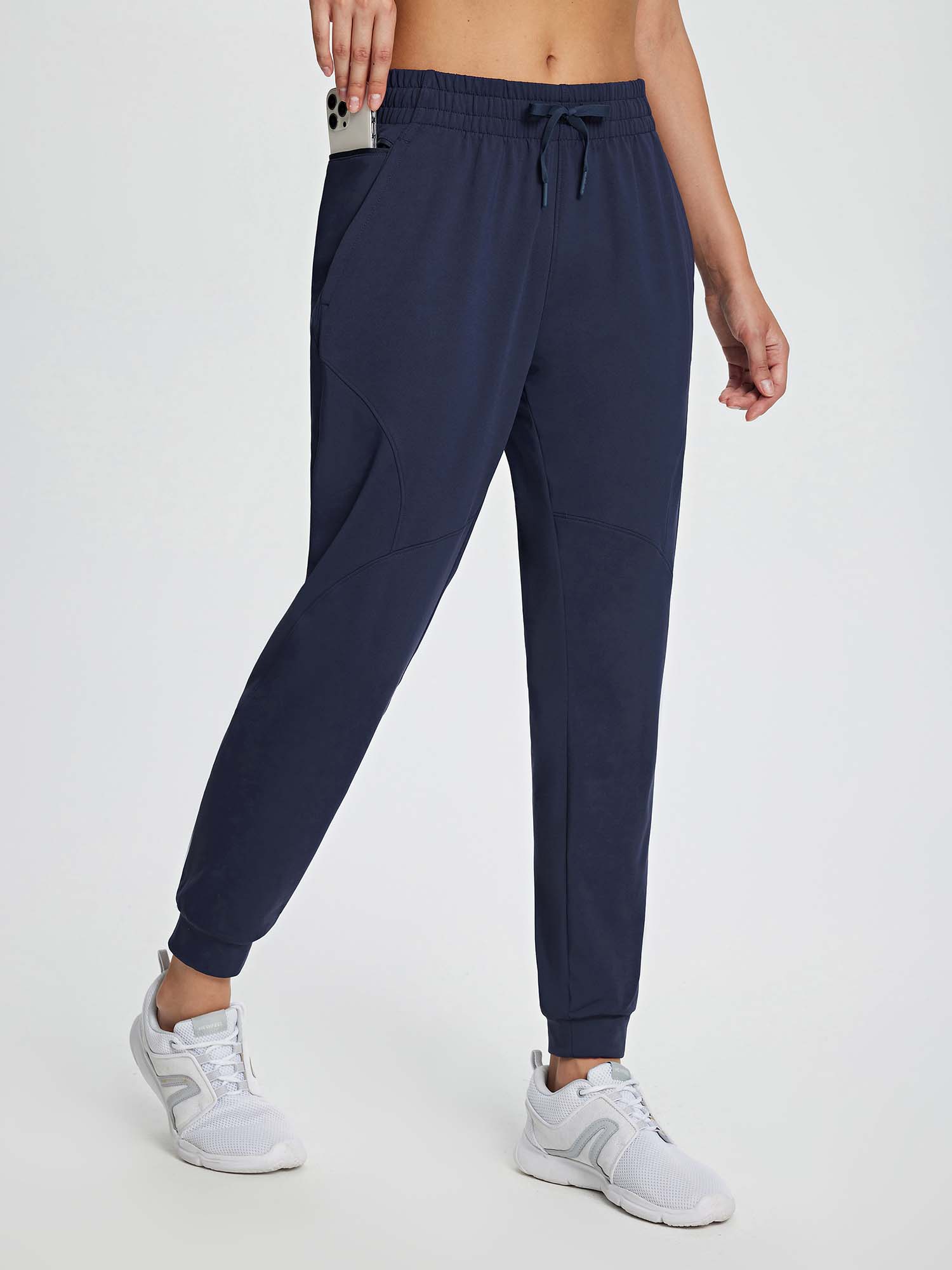 Women's navy blue fleece jogger pants with adjustable drawstring and deep side pockets. #color_Navy Blue