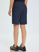 Women's navy blue 9" quick-dry hiking Bermuda shorts with zippered pockets. #color_Navy Blue