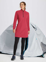 Red long-sleeve quarter zip thermal tunic dress on woman, paired with black leggings and hiking boots. Outdoor scene with tent. #color_Lava Falls