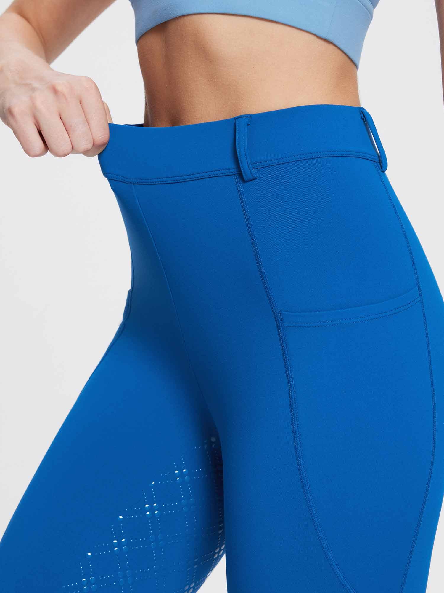 Bright blue women's fleece riding breeches with high-rise waist, pocket, and diamond silicone grip on leg. #color_Quartz Blue
