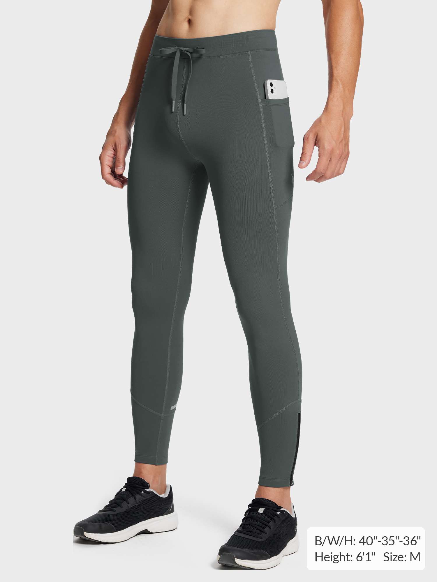 Men's dark grey fleece lined running tights with phone pocket & ankle zippers.