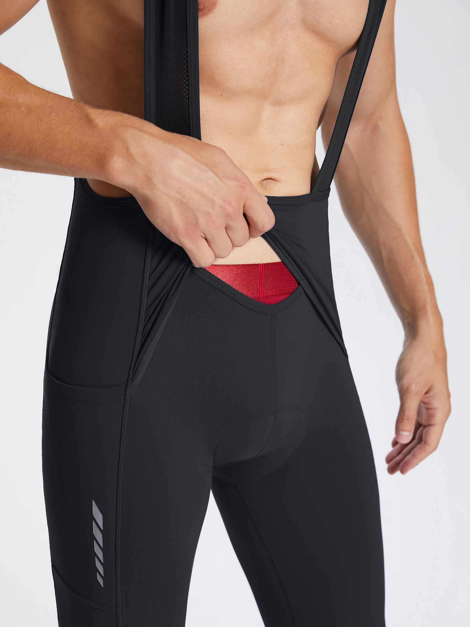 Men's black fleece bib cycling tights with convenient front opening, side pocket, and reflective detail. #color_Black