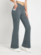 Crossover Waist Fleece Flare Pants in charcoal grey with pocket holding phone. #color_Dark Gray