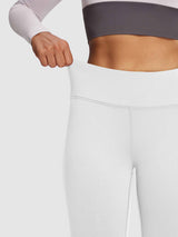 Warm white fleece lined yoga leggings showing stretchy waistband detail #color_Black/White