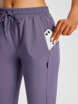 Purple pocketed capris with drawstring, phone pocket detail for everyday outdoor comfort. #color_Montana Grape