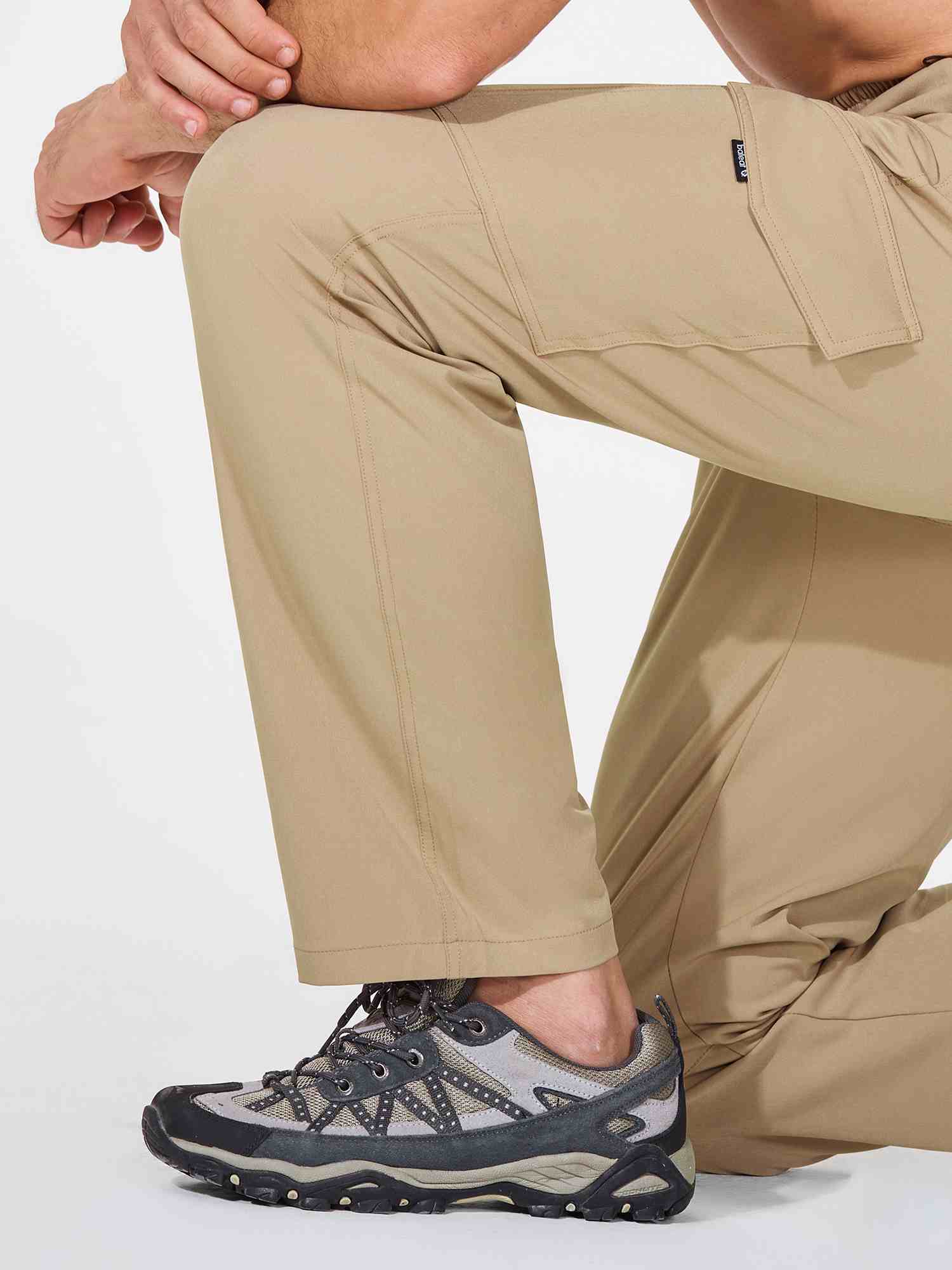 Men's khaki UPF 50+ quick-dry hiking cargo pants with multiple pockets and hiking shoes. #color_Brown