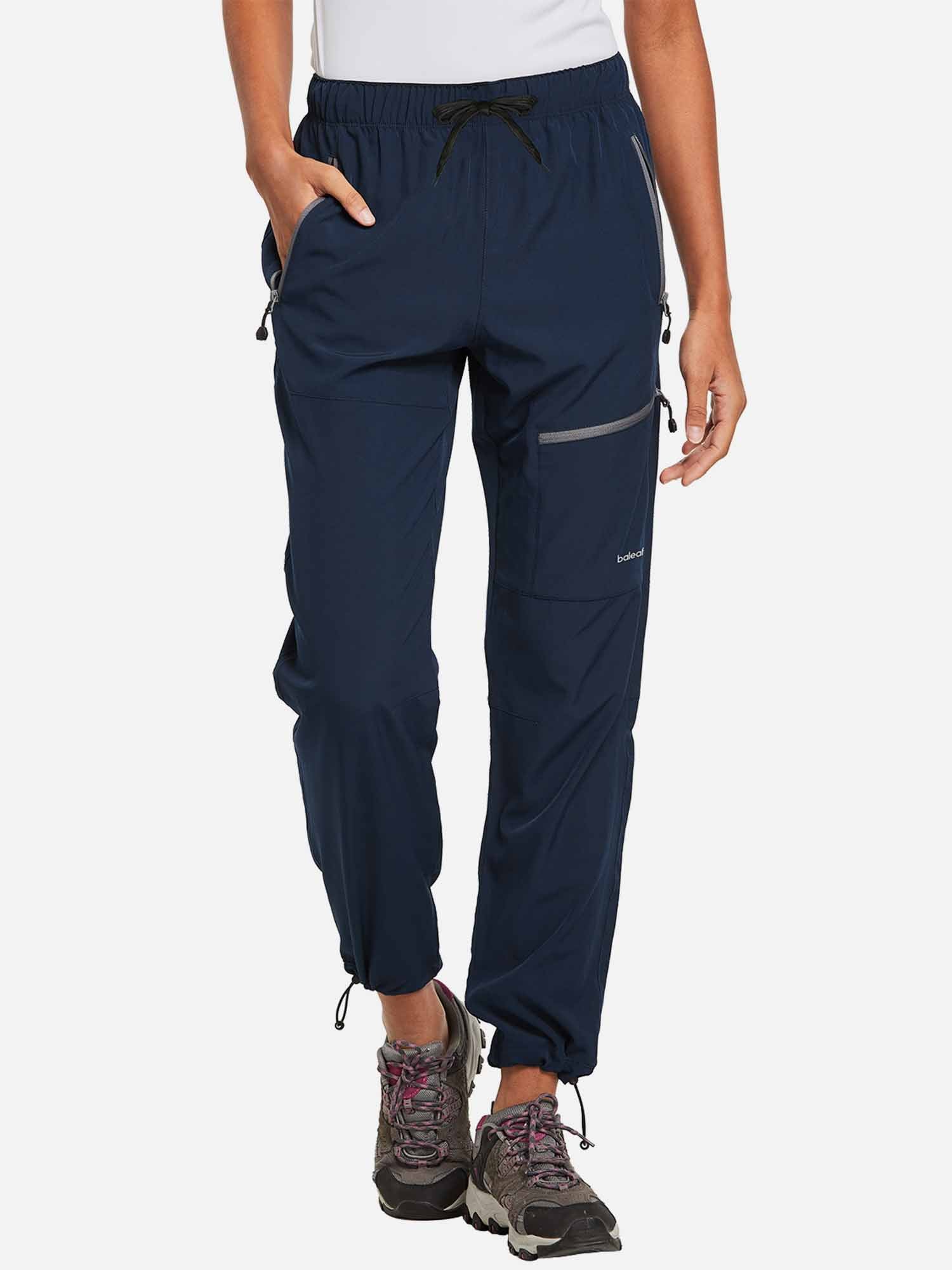 Navy blue Baleaf Laureate hiking pants with zip pockets and cinched cuffs. #color_Navy Blue