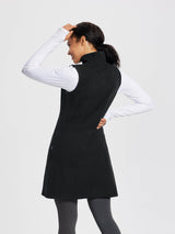 Black sleeveless fleece thermal dress with high neck, quarter-zip, and side pockets. #color_Black