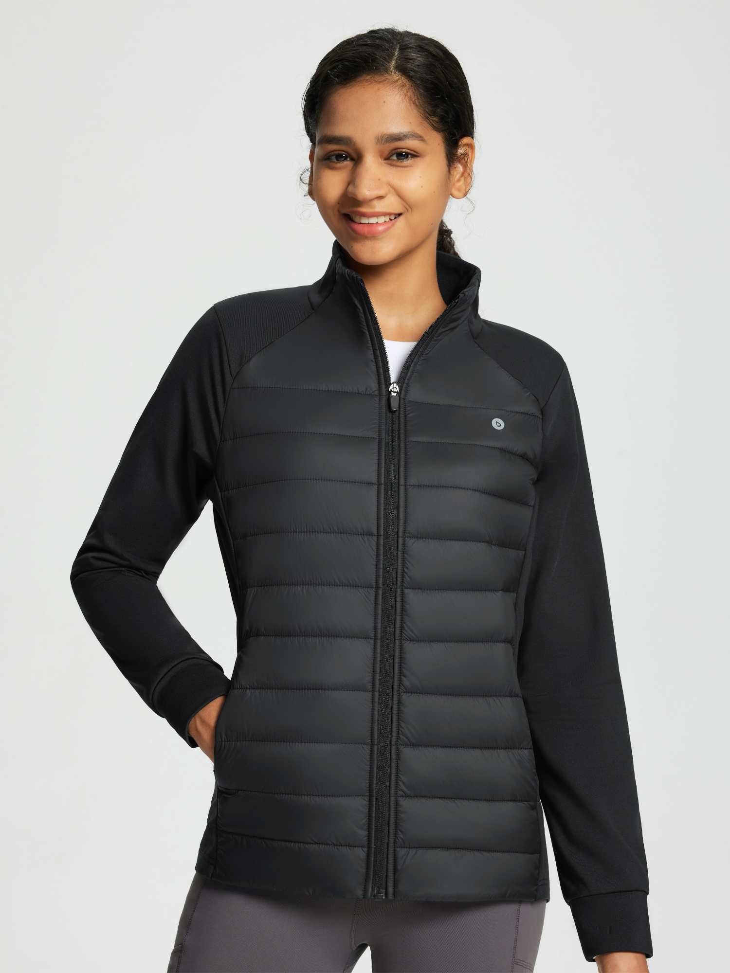 Women's black water-resistant quilted jacket with stretch sleeves #color_Black