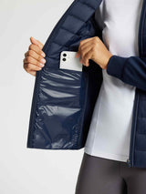 Women's navy quilted jacket inner pocket with smartphone storage. #color_Navy Blue