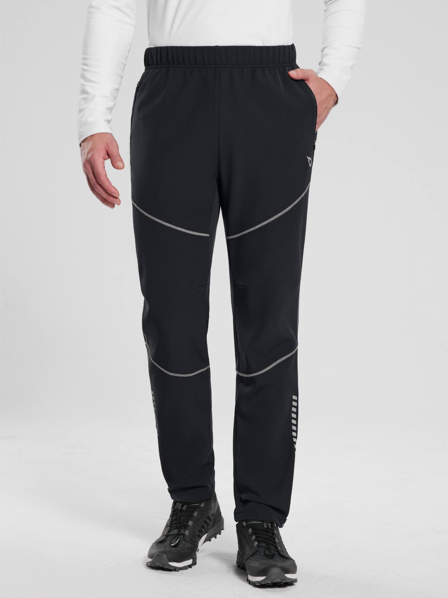 Elastic waist fleece mountain pants in black with reflective details.