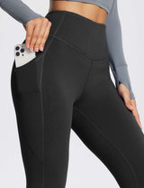 Black Laureate High-Rise Thermal Leggings with side pockets for phone storage.