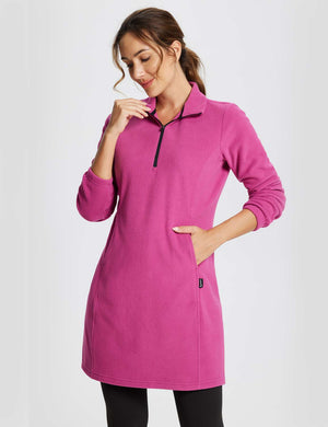 Woman wearing a long-sleeve quarter zip thermal tunic dress in Violet Rose, showing the kangaroo pocket. #color_Violet Rose