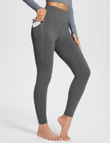 Grey high-rise thermal leggings with side pockets and contouring seams