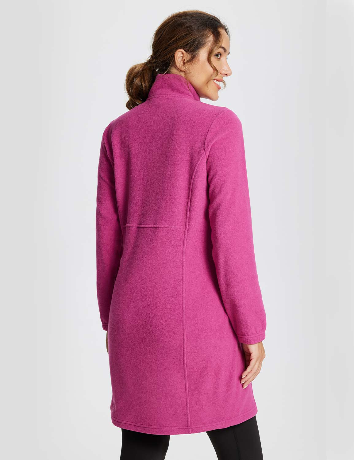 Woman wearing a long-sleeve quarter zip thermal tunic dress in vibrant violet rose. #color_Violet Rose