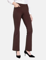Brown workleisure bootcut pants with mid-rise and four pockets, paired with a white blouse and black heels.