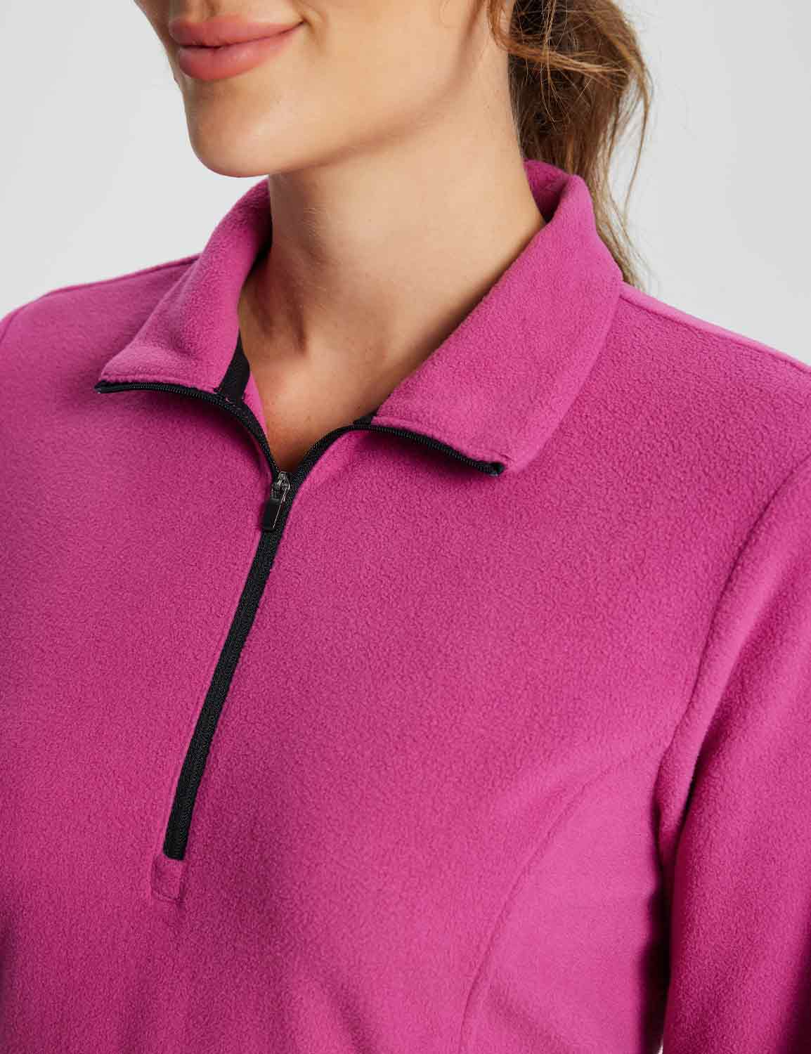 Vibrant pink fleece thermal tunic dress with black quarter zip detail and collar. Comfortable, flattering fit.