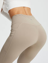Beige Laureate women's 29" crossover high-waisted flare yoga pants with V-waist and side pocket. #color_Khaki