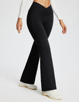 Laureate Women's black 29" crossover high-waisted flare yoga pants with pockets. #color_Black