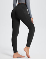 Black Laureate high-rise thermal leggings with side pockets and fleece lining.