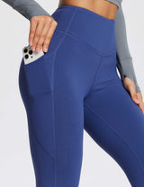 Baleaf Laureate High-Rise Thermal Leggings in blue with phone in side pocket.
