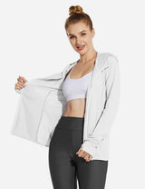 Woman in white UPF 50+ zip-up jacket & dark leggings, showing open front & thumbholes. Lightweight.