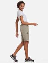 Woman in khaki Laureate UPF50+ DWR shorts and white t-shirt, model in motion for travel. #color_Khaki
