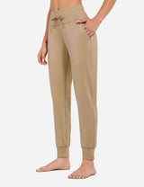 Beige Laureate Thermal Tapered Joggers with drawstring waist and side pockets. #color_Doeskin