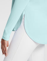 Light blue UPF 50+ long sleeve shirt with side slits and thumb loops, paired with white leggings. #color_Spa Retreat