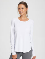 Woman wearing a white UPF 50+ long-sleeve shirt with thumbholes and side slits. #color_Lucent White