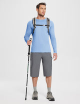 Men's light blue UPF 50+ long-sleeve sun shirt with gray cargo shorts and hiking gear